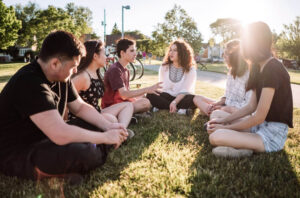 goup of teens talking in the park